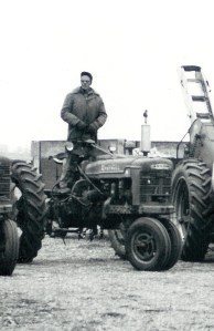 #98.1=Closeup of Russ on tractor, 1962