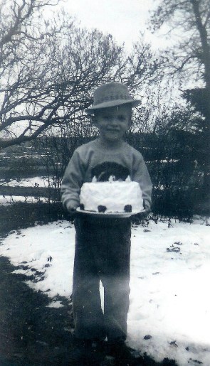 #107=Elliott with fedora hat on 6th BD; January 14, 1960
