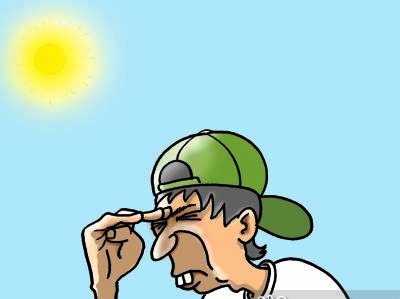 Guy wearing cap backwards, shades his eyes.