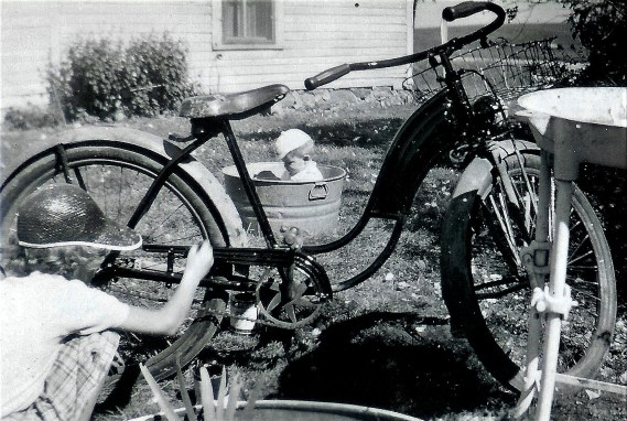 #110=Elliott in playpen tub with Rosie painting bike, circa 1955