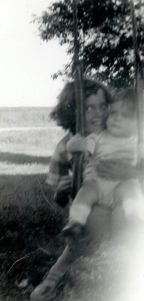 #103=elliott in tree swing with rosemary; aug. 31, 1954