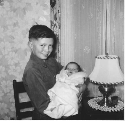 #898 lowell holds baby elliott 2.14.54 one month old.