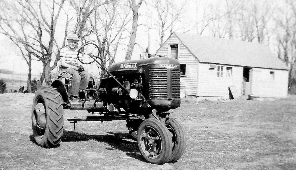 #46=Lowell on B Farmall (April 1954)