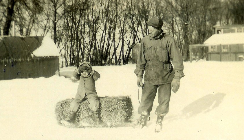 #159=Lowell on sled with bale; circa Winter 1947