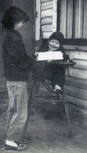 #133=Rosemary&amp;Elliott laughing with BD cake; Jan. 14th, 1955