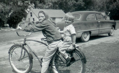 #79=Elliott &amp; Rosemary on bike near blue '49 Ford