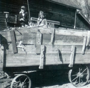 #168=Elliott&Candi in corn wagon; Oct. 1961