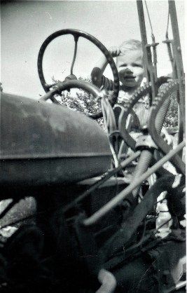 #108=Elliott on tractor, circa 1957