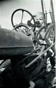 #108=Elliott on tractor, circa 1957