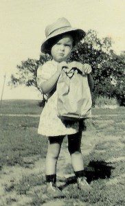 #80=Rosemary holding Dad's lunch bag, circa 1949